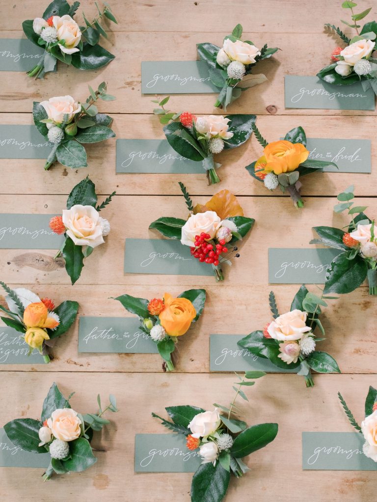 Orange, cream and berry boutonnieres 