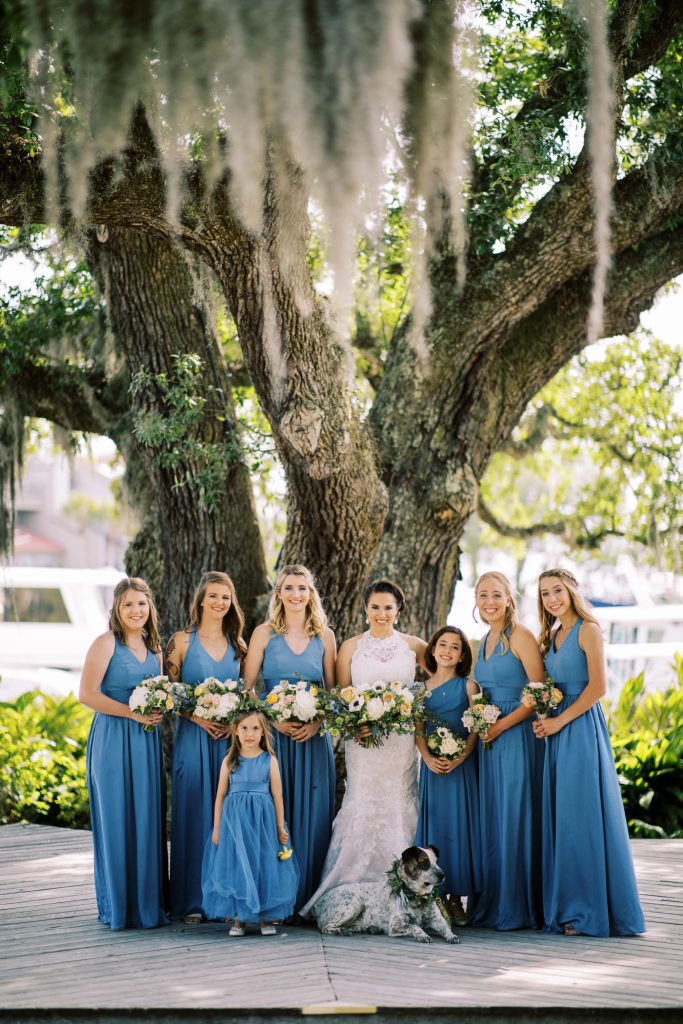 Bridesmaids in blue chiffon gowns