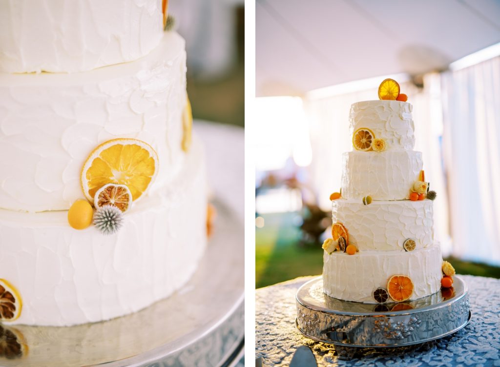 Four tier wedding cake with fresh oranges