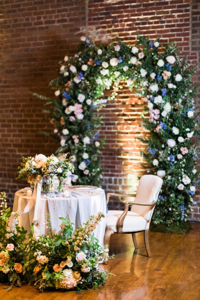 Floral arch behind a sweet heart table at Charles H Morris Center