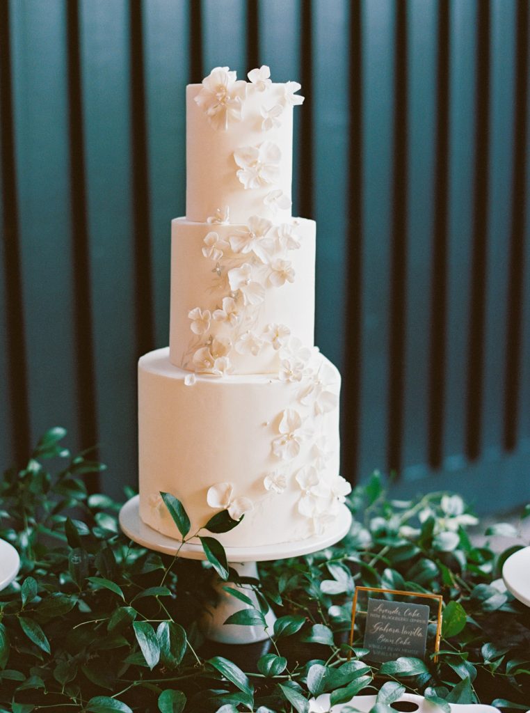 three tiered white wedding cake