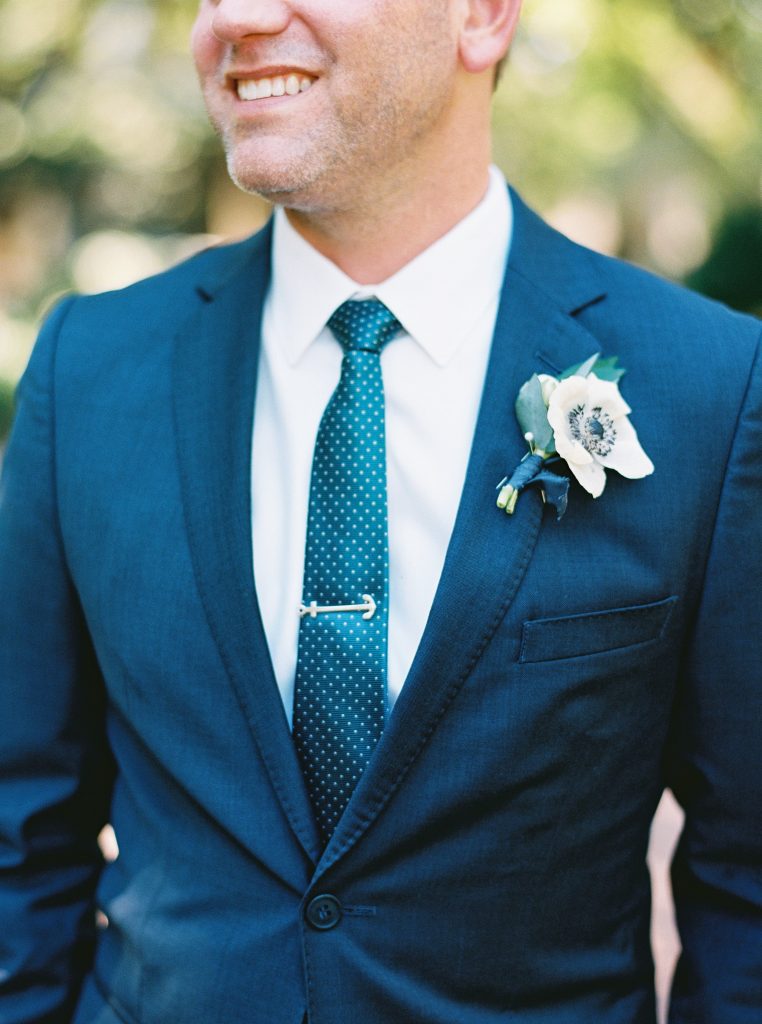 Grooms boutonniere with anemone