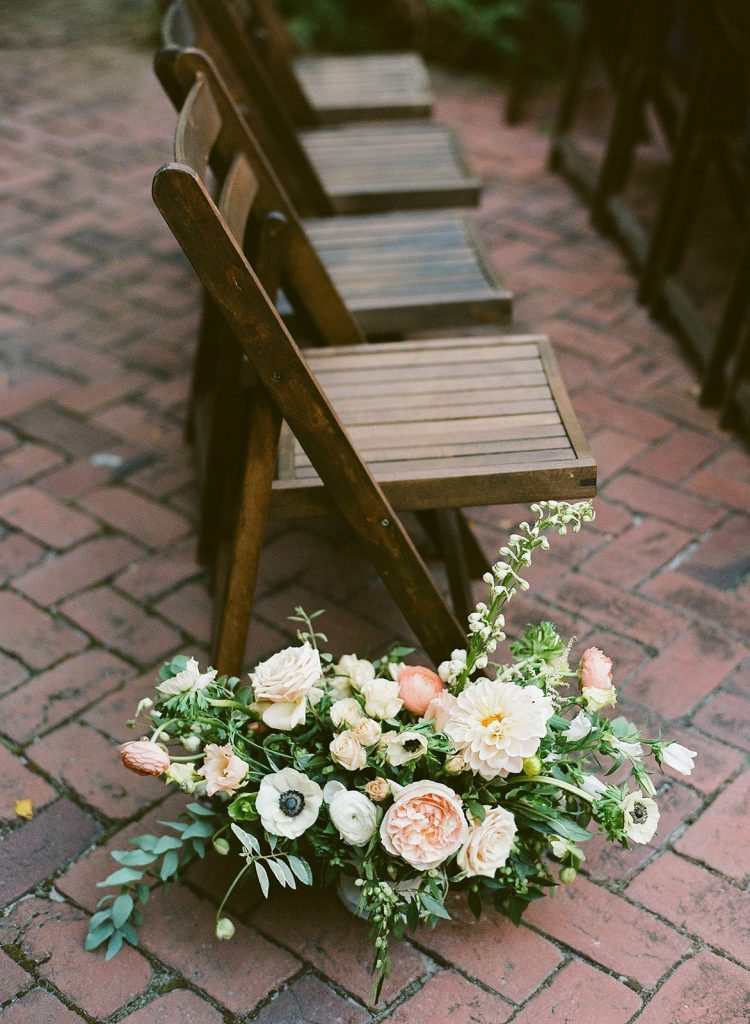 peach and white wedding ceremony florals