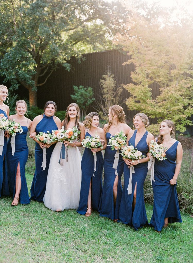 Bridesmaids in navy blue dresses
