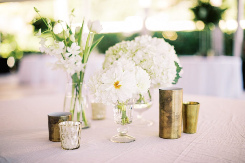 White flowers in bud vases