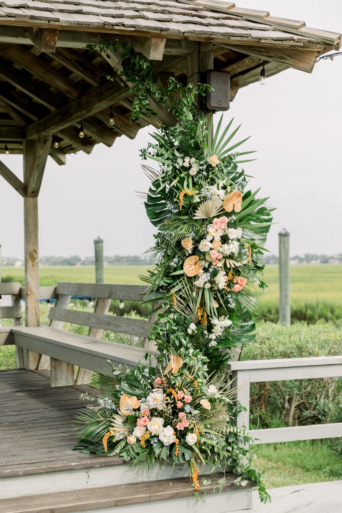 Floral installation on gazebo at wedding welcome party
