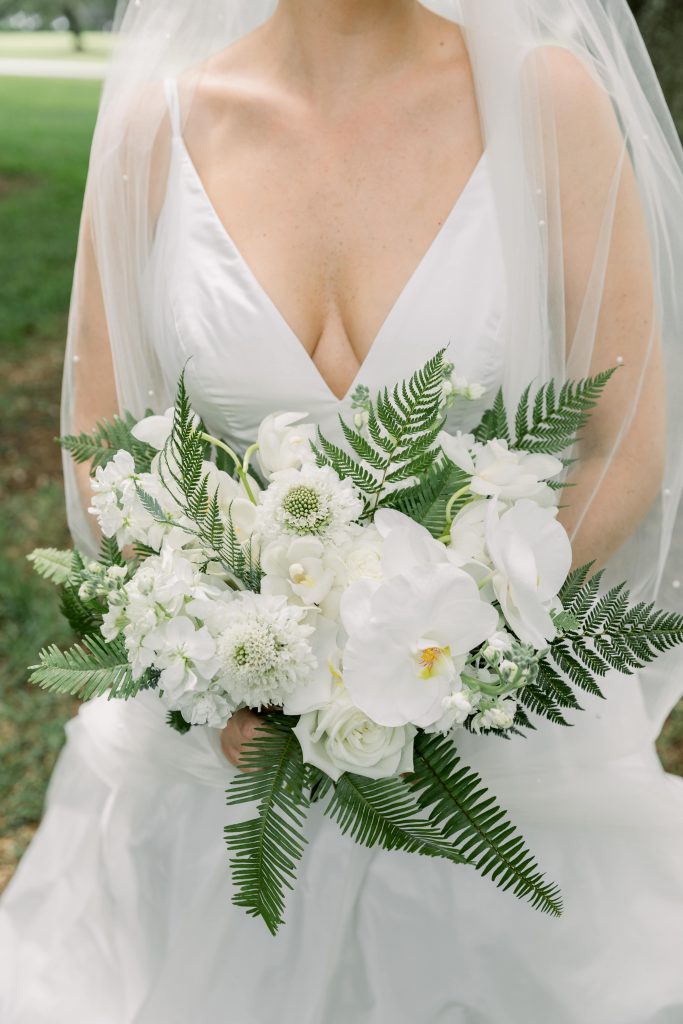White wedding bouquet with orchids and ferns