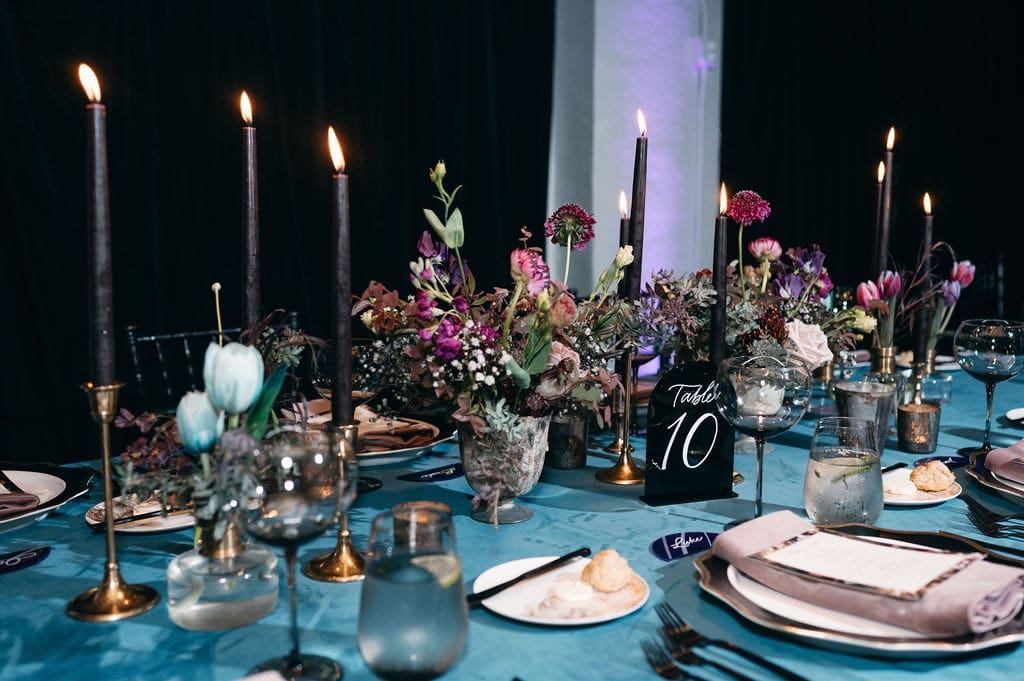 Dark and moody wedding table setting