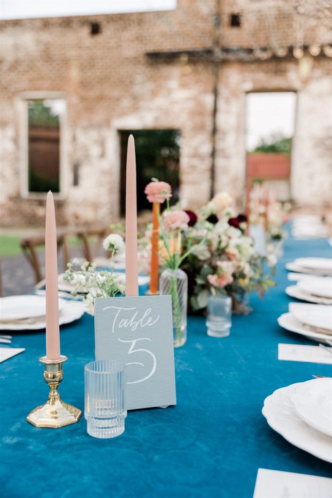 wedding table setting with turquoise and peach decor