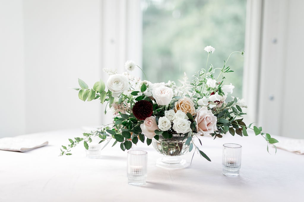 White, pink and burgundy wedding flower arrangement