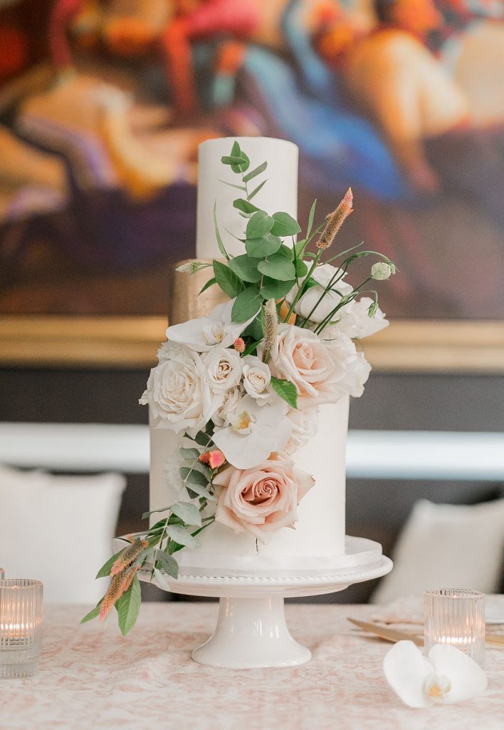 Three tiered wedding cake with fresh florals