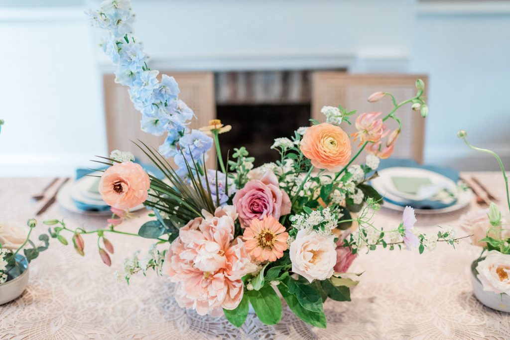 Floral wedding centrepiece with pastel tones