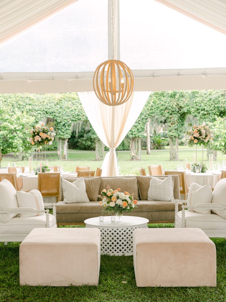 Beige and white lounge at tented wedding reception
