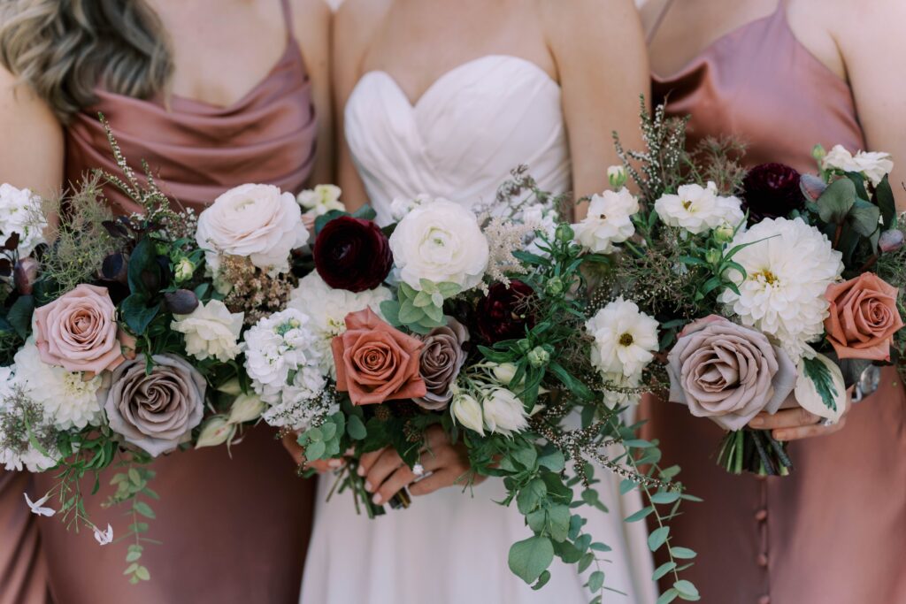 wedding bouquets with white, mauve and burgundy flowers