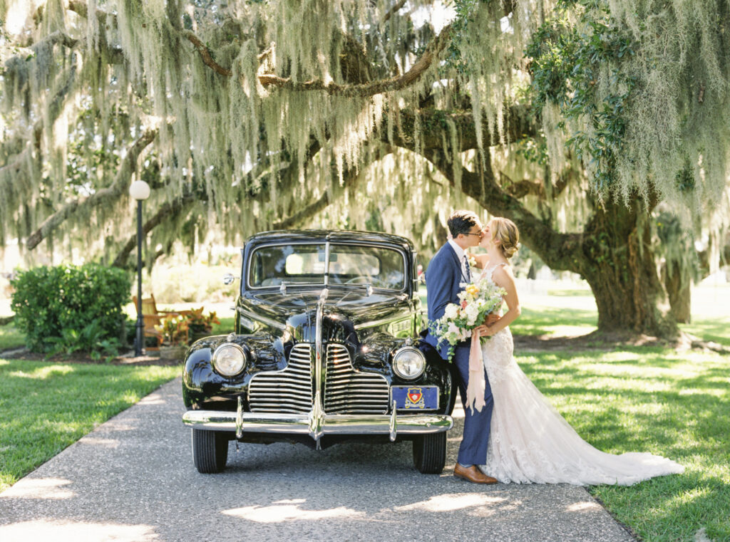 Southern bride and groom with vintage car