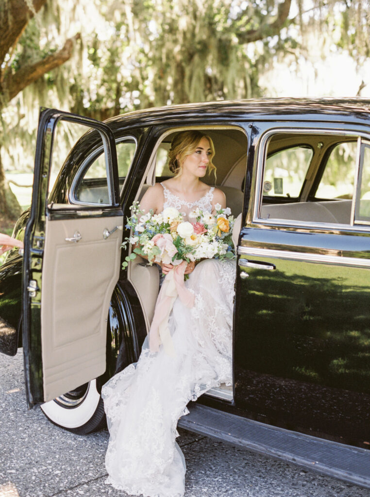 Bride with vintage car