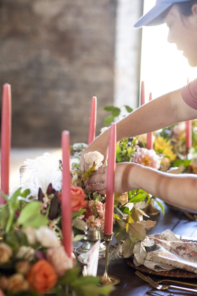 Wedding florist setting up flowers