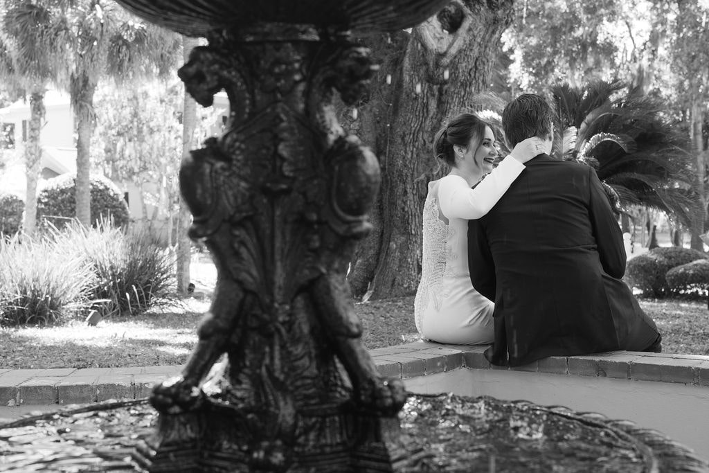 Blackand White Bride and groom portraits at water fountain