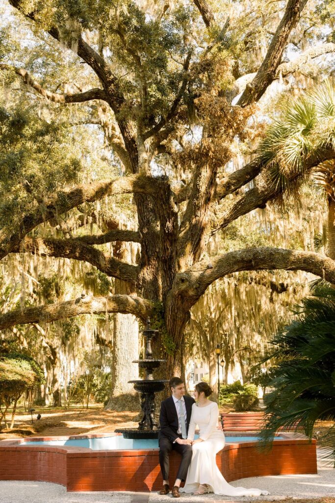 Bride and groom portraits at water fountain