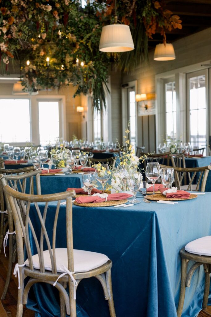 Blue tables with wood chairs at Haig Point wedding reception