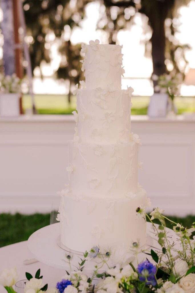 White wedding cake with white sugar flowers