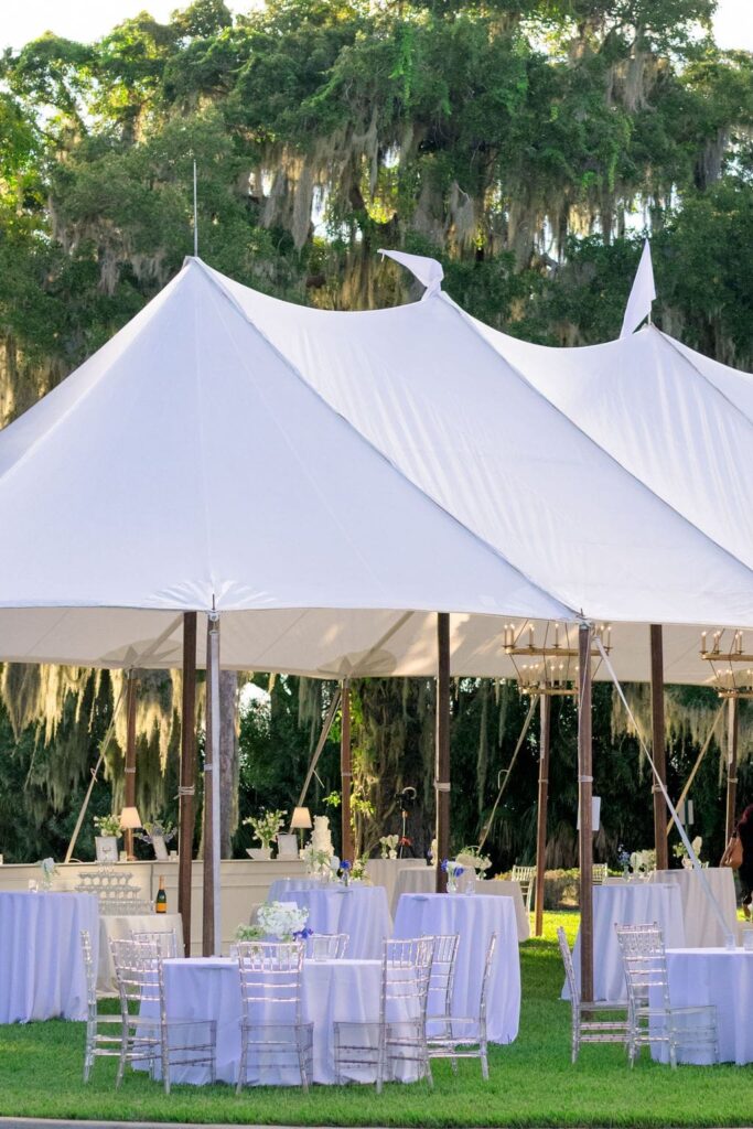 White sale tent with white tables inside
