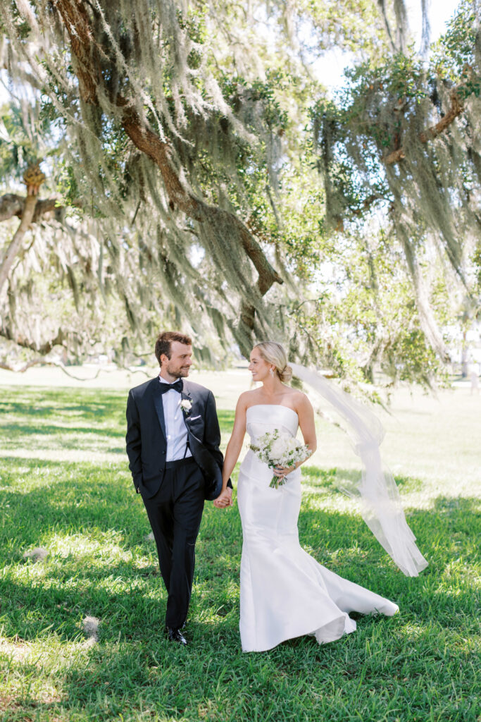 Bride and groom portrait under Spanish moss tree