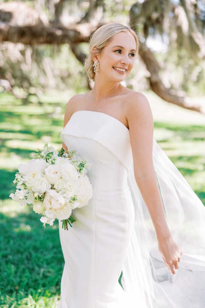 Bride in trumpet ball gown with white bouquet