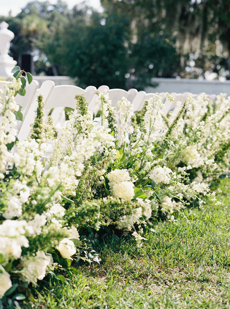 white flower arrangements at wedding ceremony