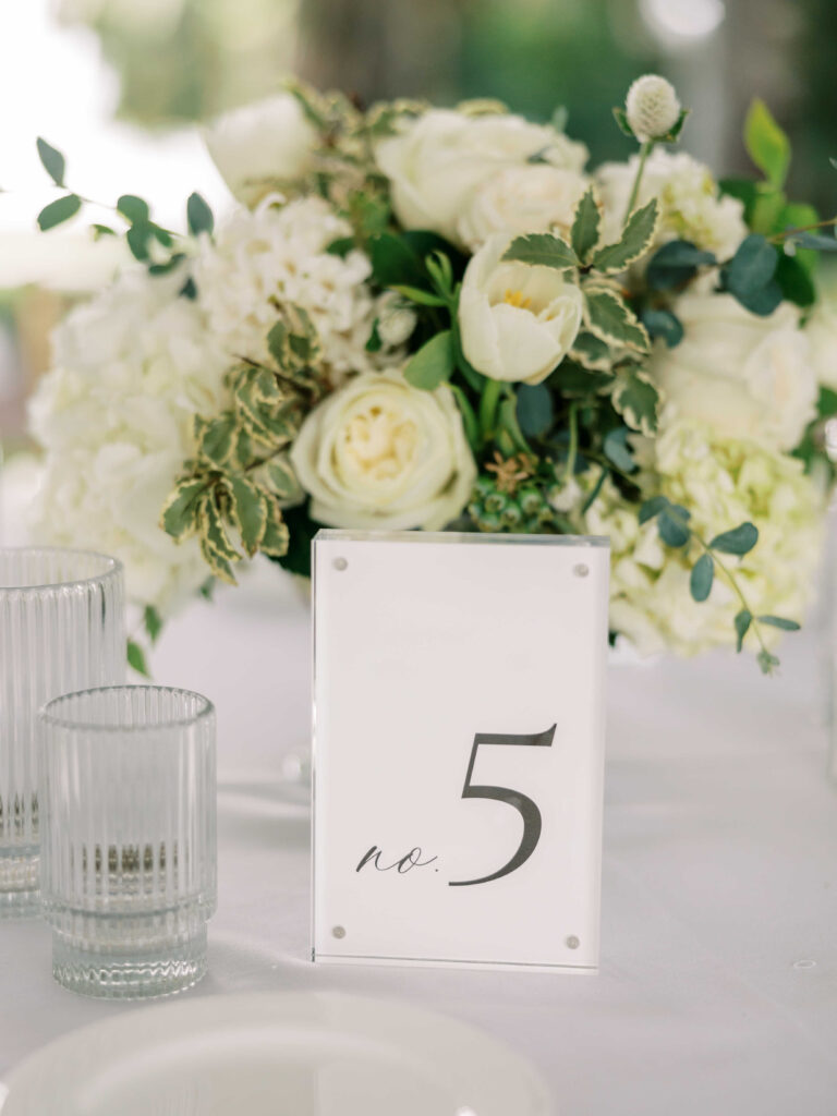 black and white table number with white centrepiece 