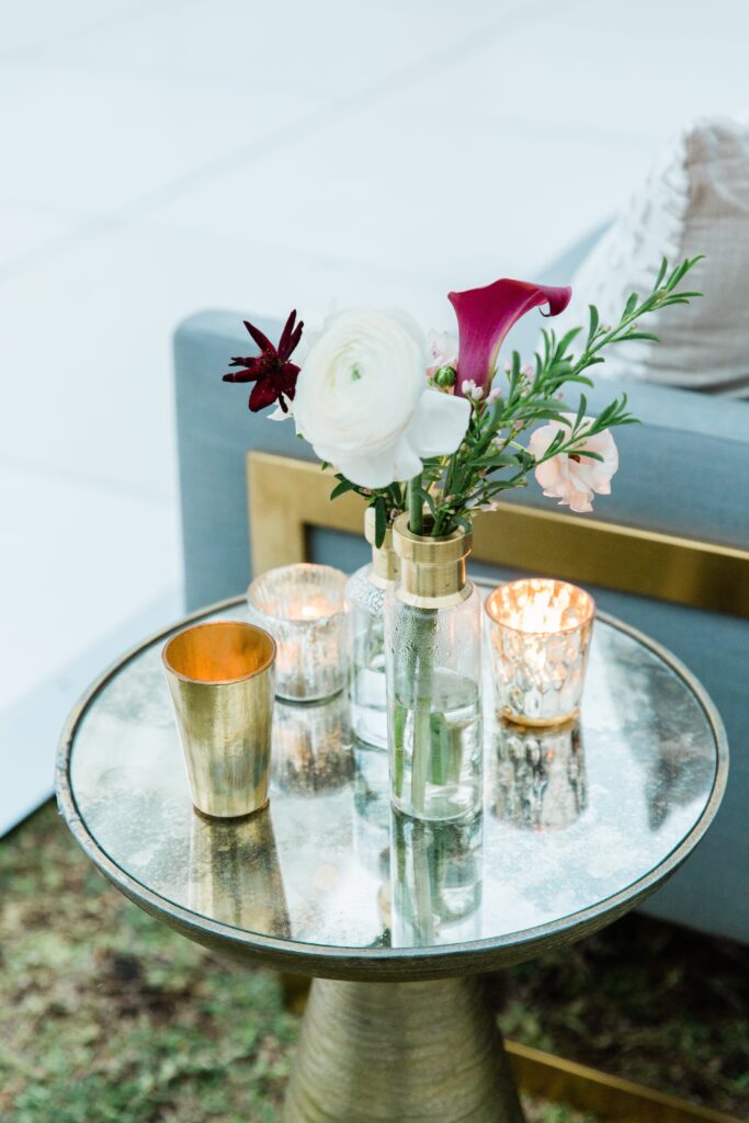 gold mirror table with flowers