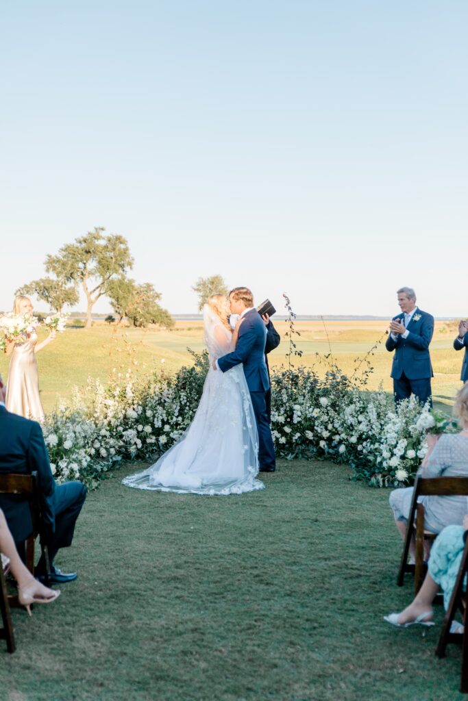 Bride and groom kissing at Colleton River Club wedding ceremony