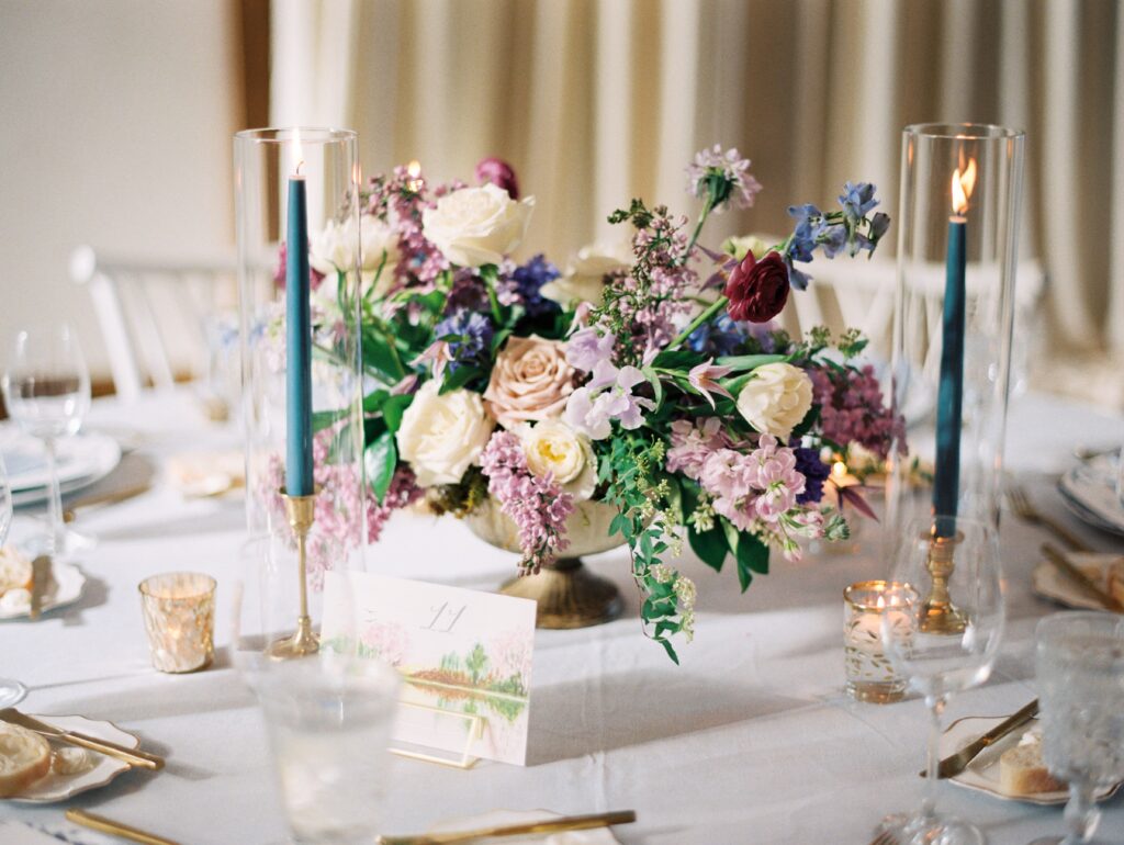 Blue, purple & pink wedding floral centrepiece
