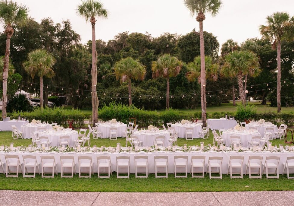 White tables & chairs on lawn at Jekyll Island Club Rehearsal Dinner